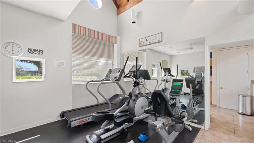 Exercise area with a towering ceiling