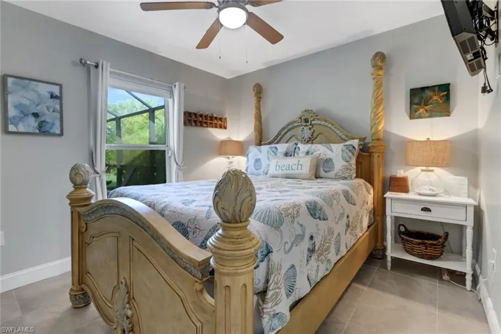 Bedroom featuring tile patterned floors and ceiling fan