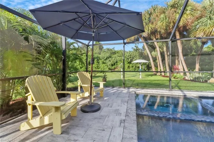 View of patio / terrace featuring a lanai