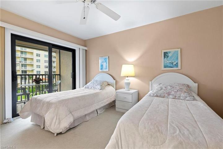 Guest bedroom has large walk in closet and screened lanai