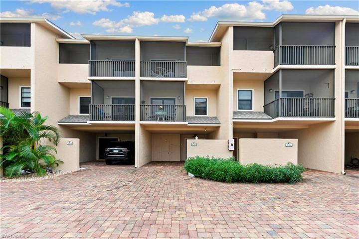Front of unit and covered carport
