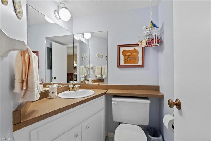 Half bathroom located on the main living level by kitchen