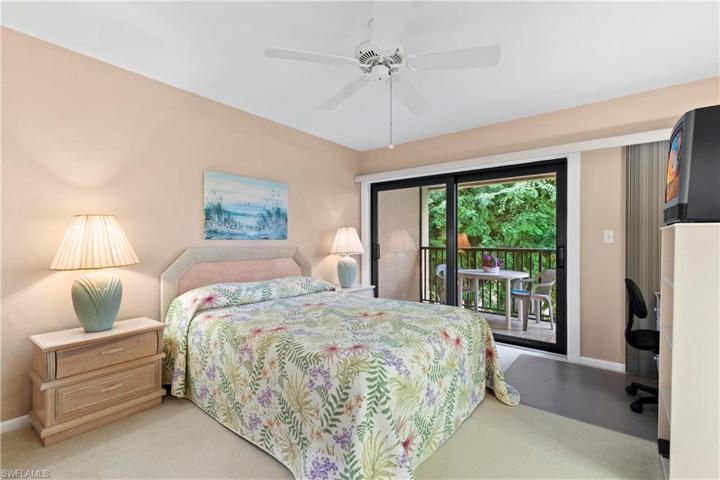 Large primary bedroom with screened lanai and impact sliders