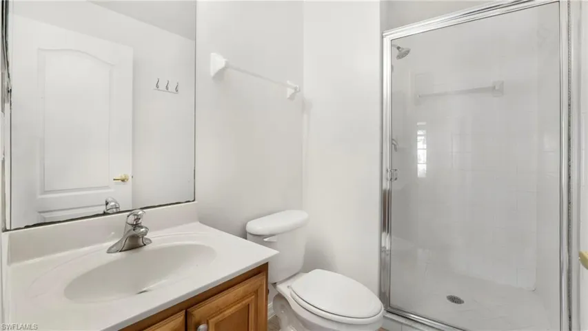 Bathroom with vanity and a shower stall