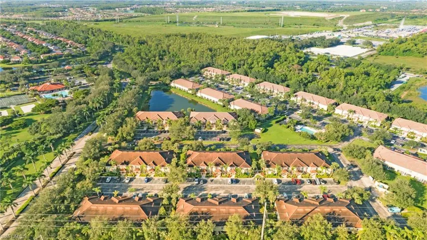 Aerial perspective of suburban area featuring a large body of water