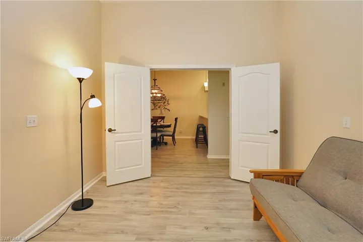French doors from den to dining/living area