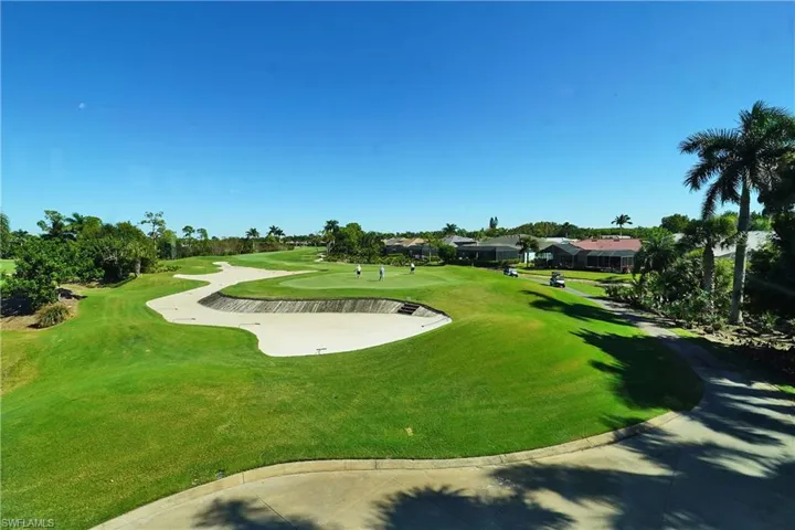 Surrounding community with view of golf course and a residential view