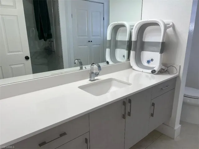Bathroom featuring vanity and light tile patterned flooring