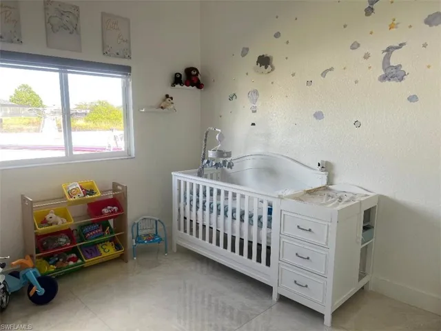 Bedroom with a nursery area