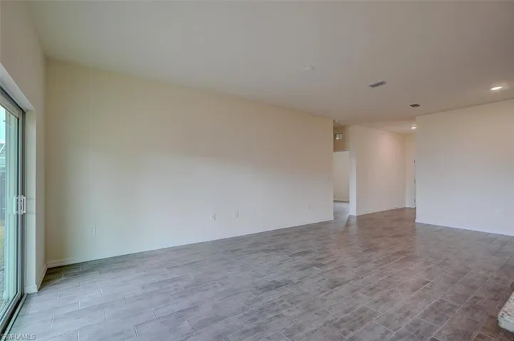 Unfurnished room with light hardwood / wood-style flooring