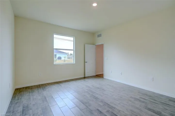 Spare room with light hardwood / wood-style floors
