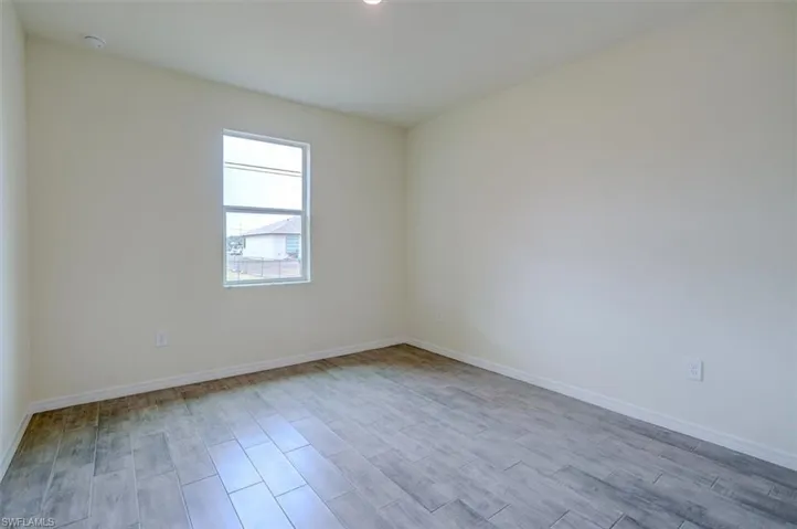 Spare room with light hardwood / wood-style floors