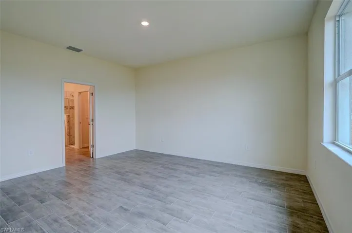 Empty room featuring light wood-type flooring