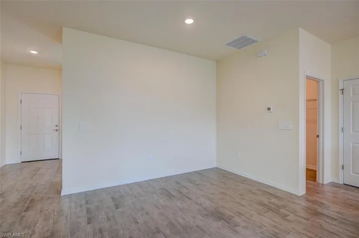 Spare room with light hardwood / wood-style flooring