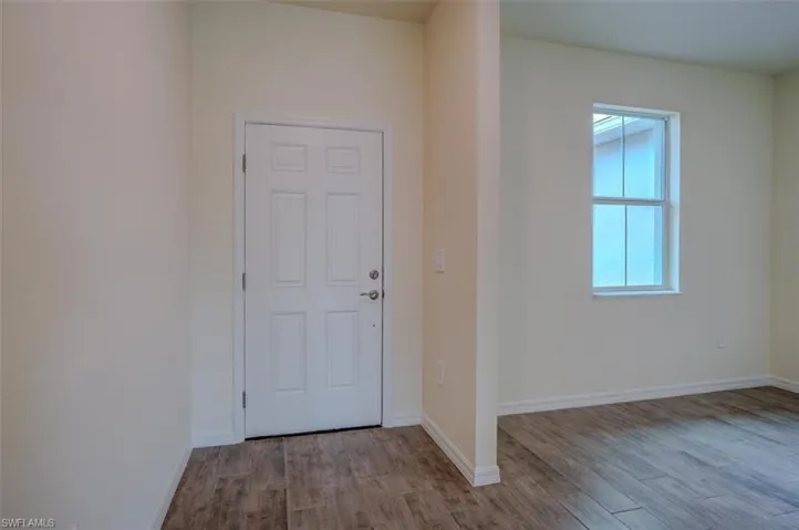 Entrance foyer featuring light wood-type tile flooring
