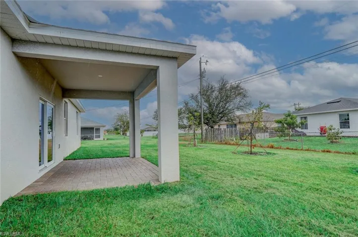 View of yard with a patio area