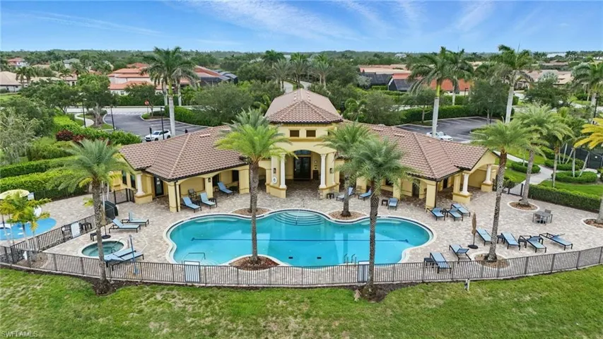 Community pool with a patio