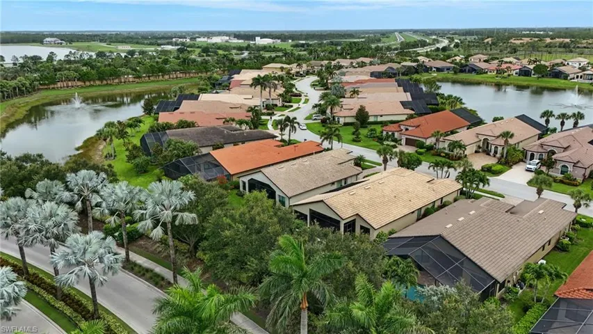 Aerial perspective of suburban area with a nearby body of water