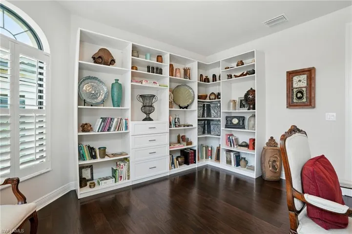 Living area featuring dark wood-type flooring