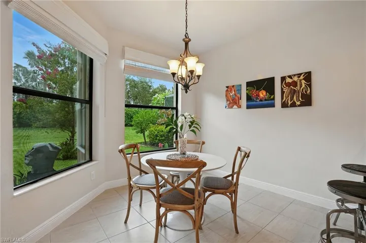 Dining room featuring a chandelier and light tile patterned floors
