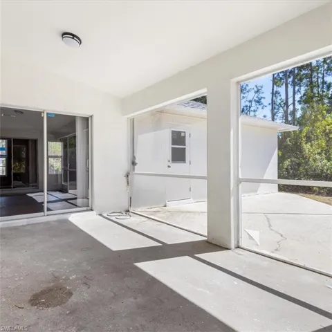 Screened patio in rear of home