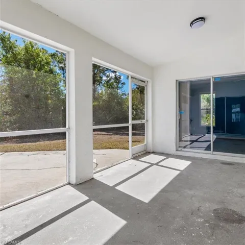 Screened patio in rear of home