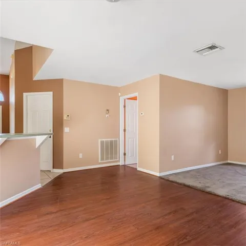 View from den, open door is the laundry room, closed door is access to 2 car garage