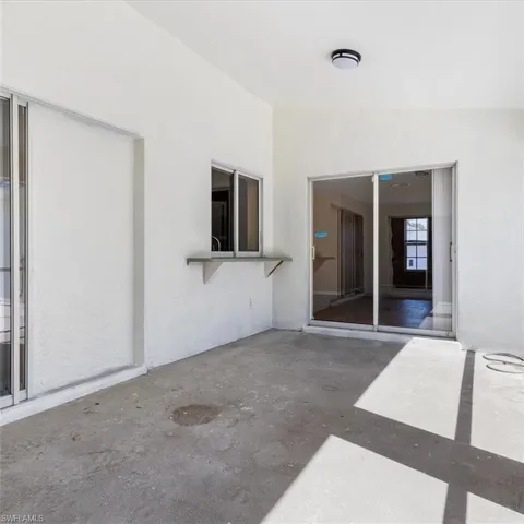 Screened patio in rear of home