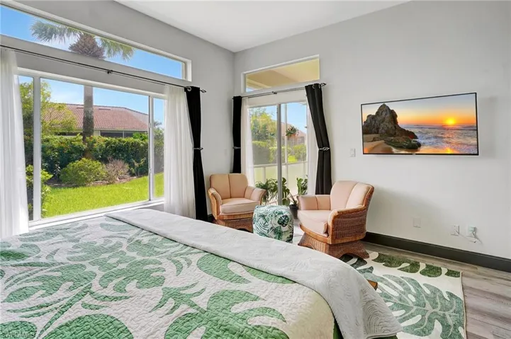 Bedroom featuring light wood-type flooring and multiple windows