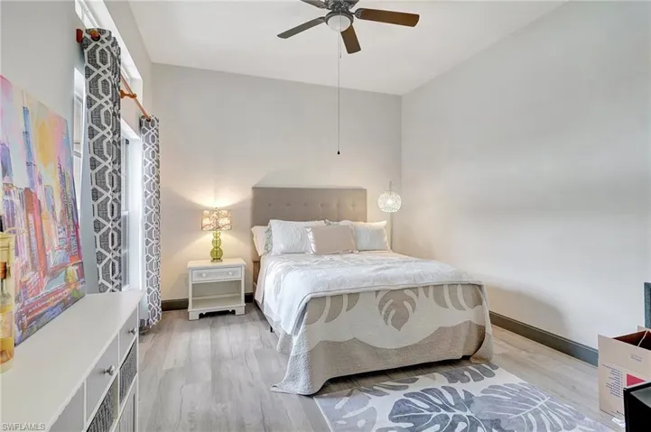 Bedroom featuring light hardwood / wood-style floors and ceiling fan