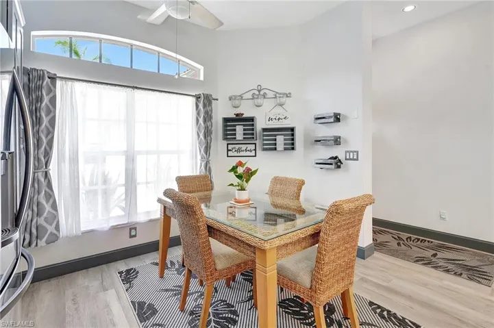 Dining space featuring ceiling fan and hardwood / wood-style floors