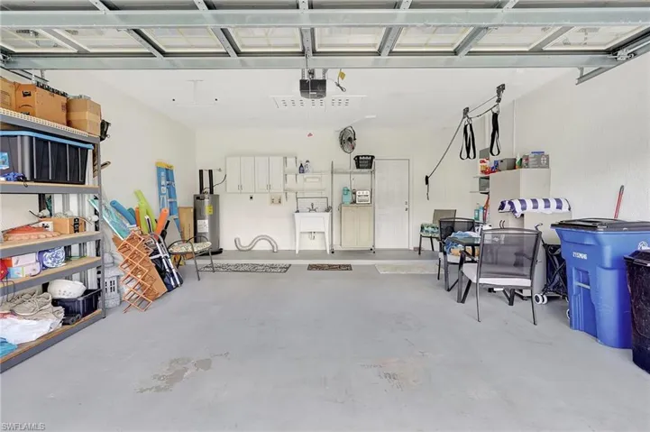 Garage with a garage door opener and water heater
