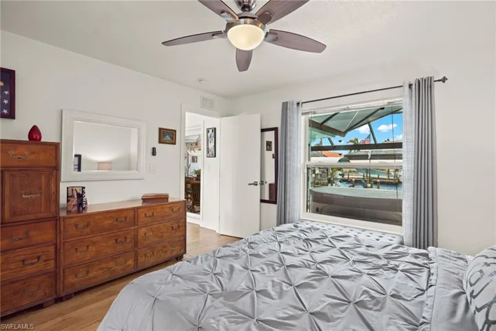 Bedroom with light hardwood / wood-style flooring and ceiling fan
