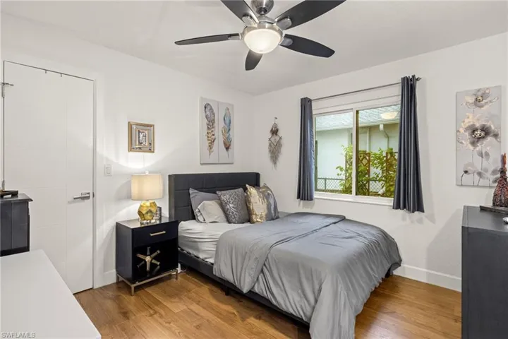 Bedroom with wood-type flooring and ceiling fan