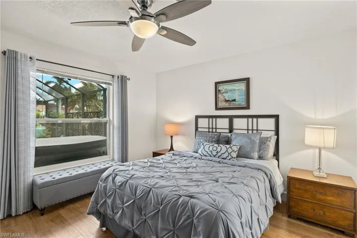 Bedroom featuring ceiling fan and hardwood / wood-style flooring