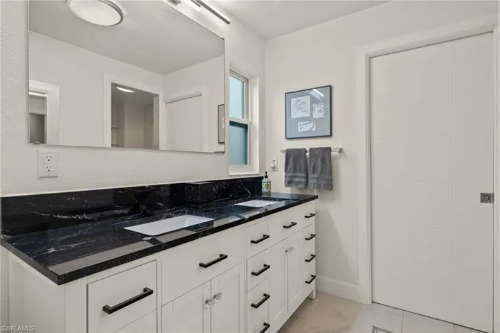 Bathroom featuring vanity and a textured ceiling