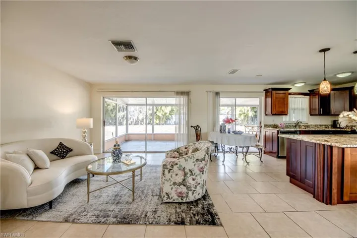 Living room with plenty of natural light and light tile patterned flooring