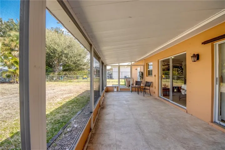 View of patio / terrace featuring a sunroom
