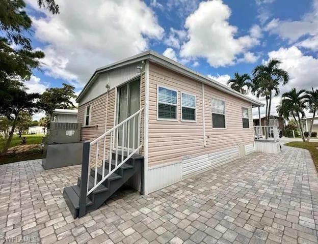 View of side of property with a patio