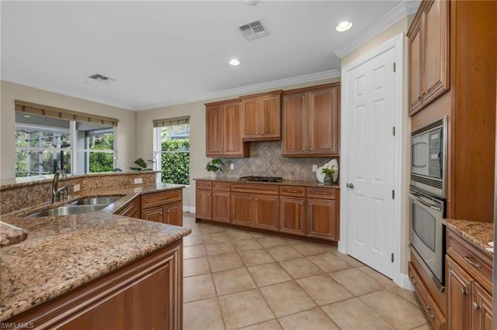 Upgraded cabinets, drawer pull outs on lower cabinets and gas stove.