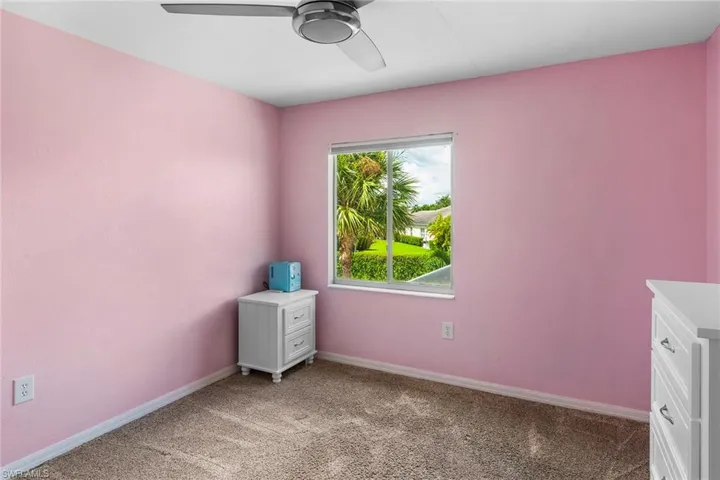Unfurnished bedroom with ceiling fan