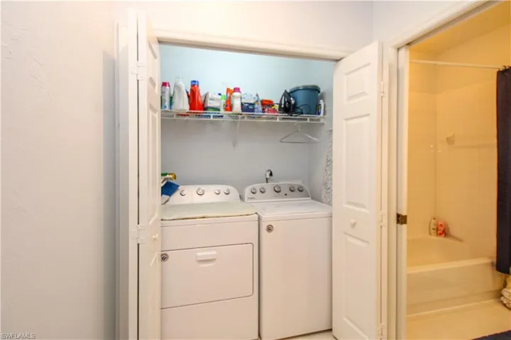 Laundry room with washing machine and clothes dryer