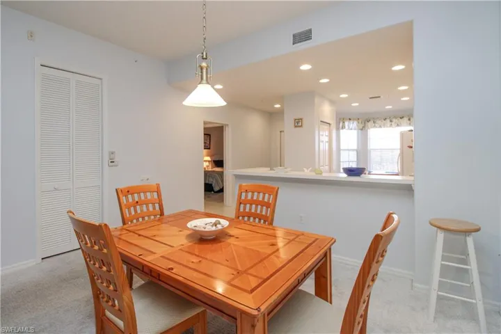 Dining area with light colored carpet