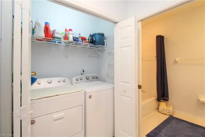 Laundry area featuring separate washer and dryer