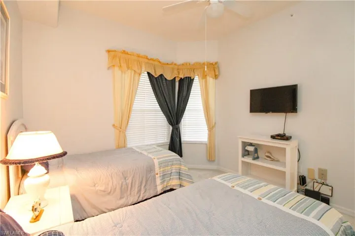 Bedroom featuring carpet flooring and ceiling fan