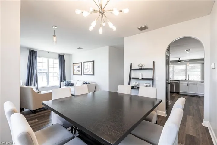 Dining room with a chandelier, dark hardwood / wood-style floors, plenty of natural light, and sink