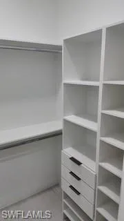 Walk in closet featuring light wood-style floors