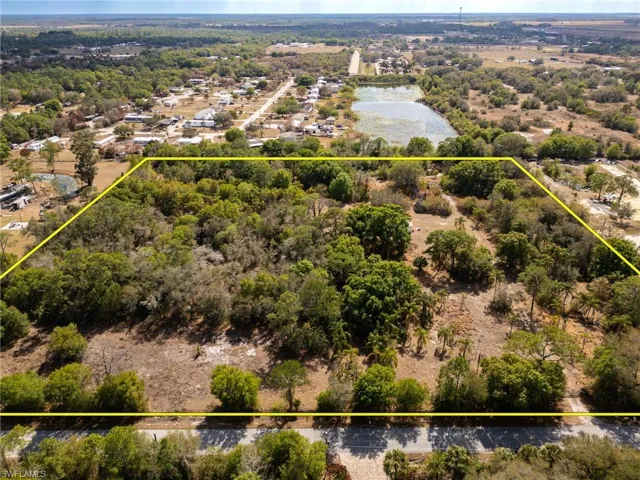 Aerial overview of property's location featuring property parcel outlined