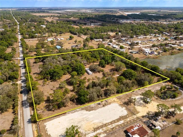 Aerial overview of property's location featuring property parcel outlined
