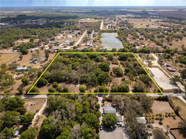 Aerial view of property's location with property boundaries highlighted and a large body of water